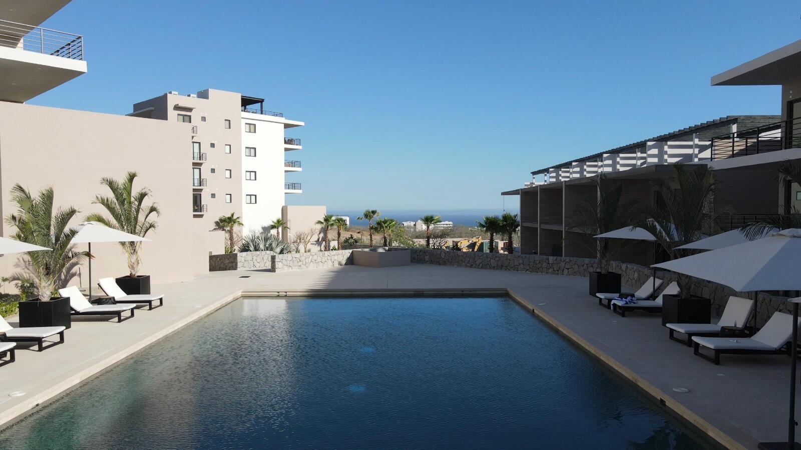 Los Cabos Breeze Of Cabo Discover the charm of Ground Floor Unit #103 at Breeze of Cabo, located in the sought-after Sunset area of Cabo San Lucas.This modern 2-bedroom, 2-bathroom condo features a spacious private patio — perfect for enjoying the warm weather and outdoor living. , the unit includes underground parking and access to a shared rooftop with a swimming pool and panoramic ocean for sale