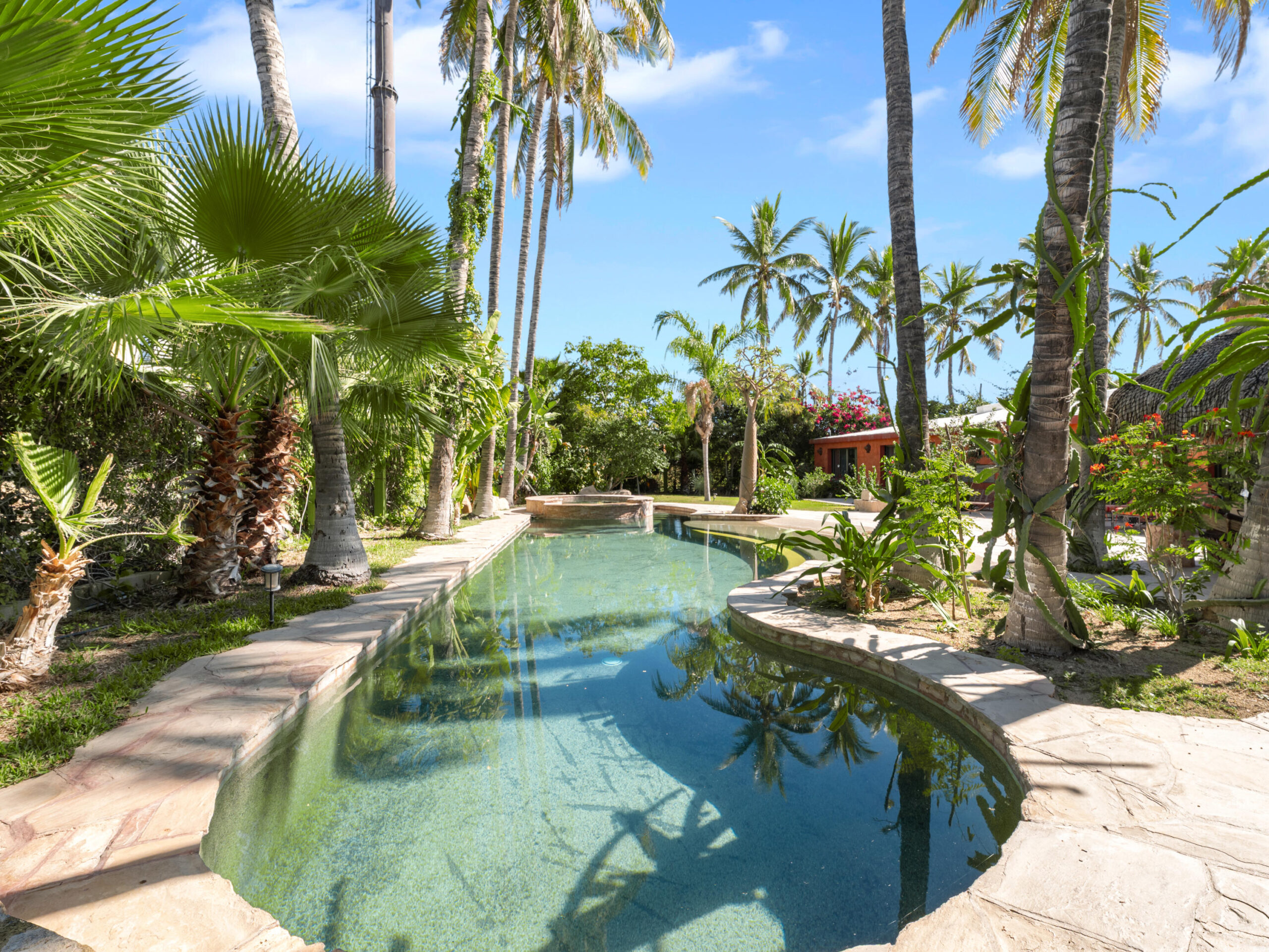 Los Cabos El Tezal-Oceanside:General Located along the highly sought-after Cabo Corridor, this charming 2-bedroom, 2-bathroom open-concept home is set within a lush, private garden oasis filled with mature tropical landscaping. The seamless indoor-outdoor layout flows effortlessly into a stunning lagoon-style pool, creating a peaceful, resort-like setting ideal for relaxing or entertaining.With its expansive grounds and prime location on the corridor just minutes from downtown Cabo San Lucas, the property offers incredible flexibility. Whether envisioned as a private residence, boutique event space and hotel, or future condo development, this is a rare opportunity to own a versatile property in one of Cabo's fastest-growing areas. for sale