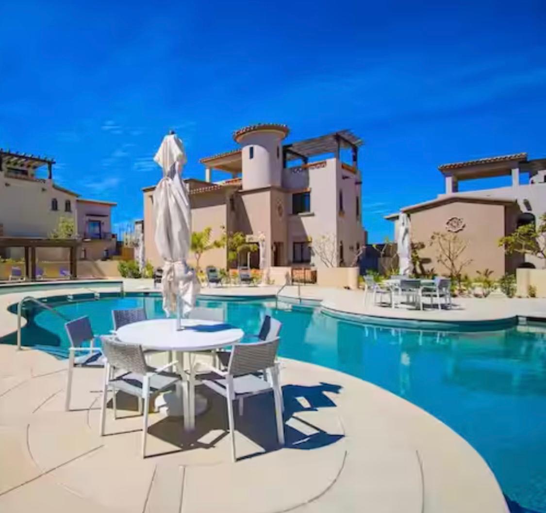 Los Cabos Camino Viejo Condominiums PRICE IMPROVEMENT!!!! Discover over 1,500 sq ft of modern, light-filled living just a 10-minute stroll from Medano Beach. This oceanside 2 bed/2 bath unit features high ceilings, quality finishes, and large wrap-around balcony perfect for indoor/outdoor living. Building amenities include underground parking with electrical outlet for your EV, elevator, storage unit, and security guard. Building is wheelchair accessible. Also included is a rooftop heated ocean- for sale