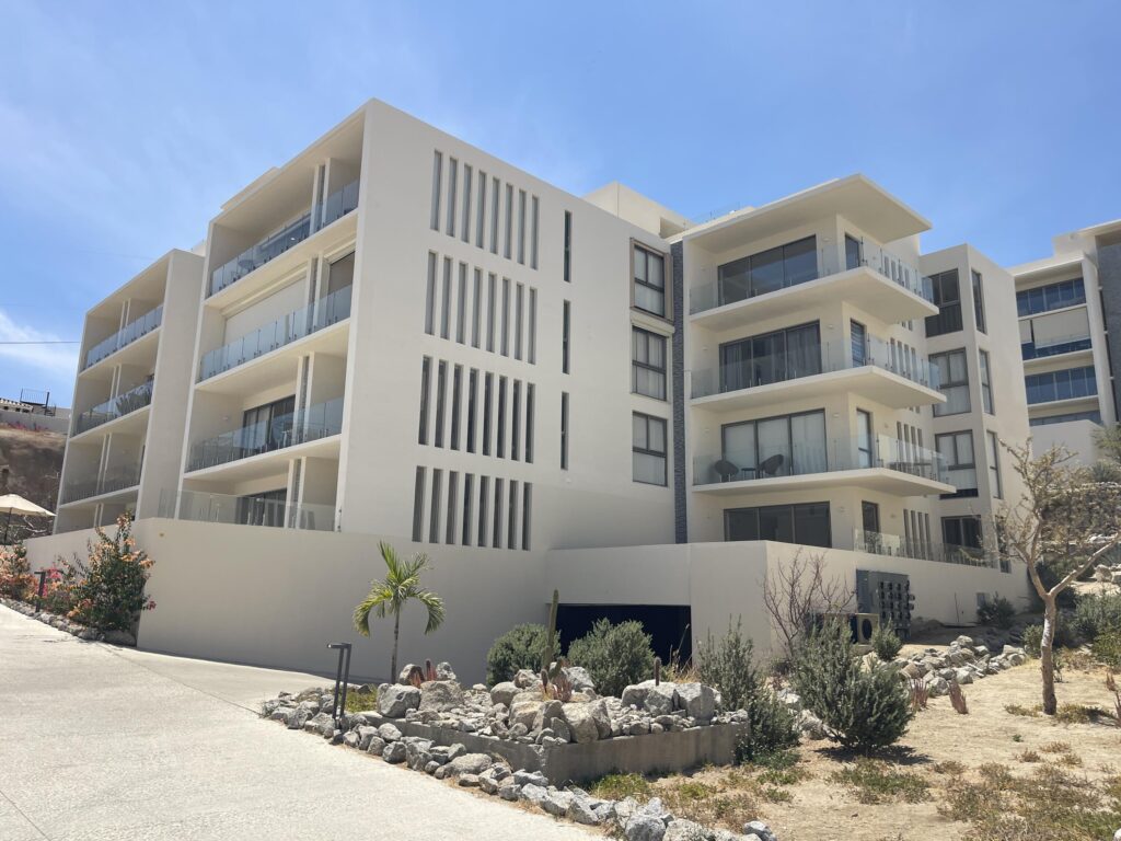 Los Cabos Cabo Costa POOL INCLUDED! This stunning 2-bedroom condo with huge deck is located on the first level in the Balandra Tower of Cabo Costa . Cabo Costa is the newest community that blends its arquitectural designs with nature. This unit has been meticulously designed and comprises two end-suite bedrooms. The property interior is designed in neutral tones to create a modern, welcoming and luxurious home yet retaining its original features. Amenities such as a Club House, Infinity pool, Gym, sundeck, Kids area, Jacuzzi, Wetbar, Snackbar & Massage area. – P.º De La Marina, Cabo San Lucas, BS