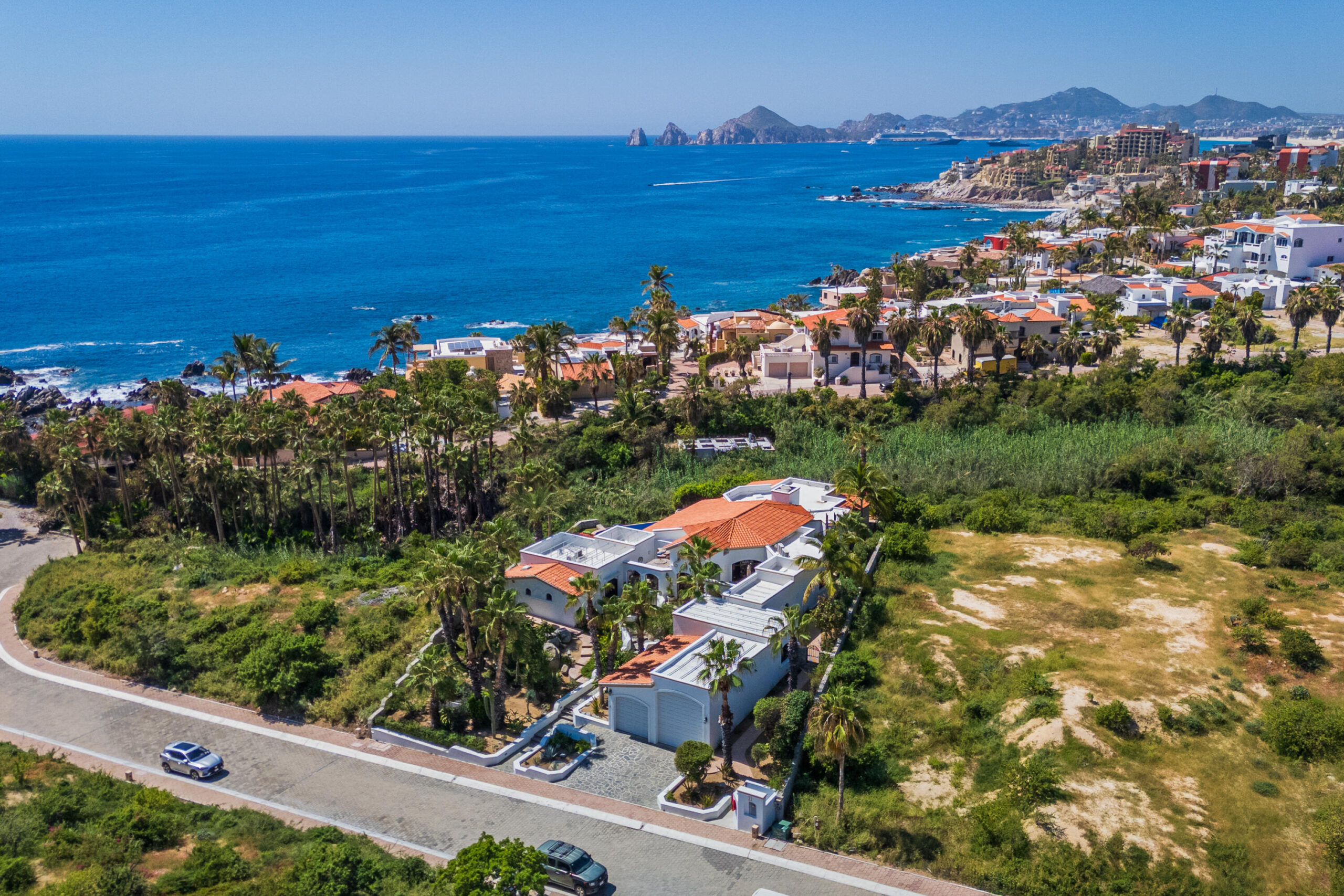 Los Cabos Cabo Colorado Discover modern luxury in this exquisitely designed home, built in 2020 and nestled within the exclusive, beachfront, private gated community of Cabo Colorado in San José del Cabo—just 2 miles from Palmilla Beach. Enjoy the convenience of living just steps from a stunning, sandy private beach within the community.With a striking contemporary aesthetic, this residence features gleaming white marble floors, beautifully appointed marble bathrooms, and captivating ocean for sale