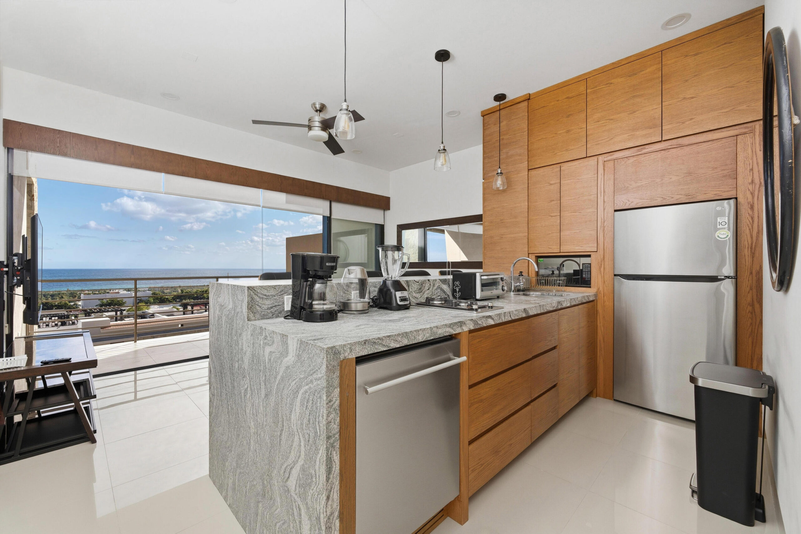 Los Cabos Coyote Located in the exclusive lower Pedregal community, this modern 1-bedroom, 1-bathroom condominium at Coyote Tower offers a comfortable and stylish living experience. With approximately 800 sq ft of total living space, including a private terrace or garden depending on the unit, the residence features an open-concept layout with kitchen, living area, and laundry space. High-quality finishes include porcelain tile flooring, custom cabinetry, and a functional, well-designed kitchen. The bedroom offers a spacious closet and a private bathroom with modern vanity. Enjoy beautiful mountain for sale