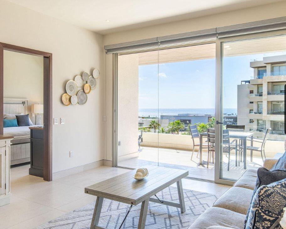 Los Cabos Marea Los Cabos Located in the exclusive Marea development, this 1,480 sq. ft. condo offers the premier downtown Cabo San Lucas lifestyle just 500 meters from Medano Beach. The contemporary, open-concept design features three spacious bedrooms--each with its own private balcony--and floor-to-ceiling windows that flood the sleek, white-cabinetry kitchen and living areas with natural light. This turnkey property is a lucrative opportunity for investors, coming fully furnished, equipped, and ready for immediate rental income with no renovations required. Residents enjoy premium community amenities, including 24/7 security, a lobby, a gym, and a sparkling pool. The standout rooftop terrace, with a jacuzzi , provides the perfect vantage point to take in the city for sale